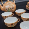 Komplet japońskiej porcelany – 21-elementowy zestaw herbaciano-kawowy z motywem gejszy, 6-osobowy