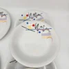 Zestaw 7 talerzy porcelitowych Tułowice – wzór geometryczny Memphis, lata 90.