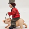 Gilde Clowns – Klaun jadący na śwince, wysokość 14 cm