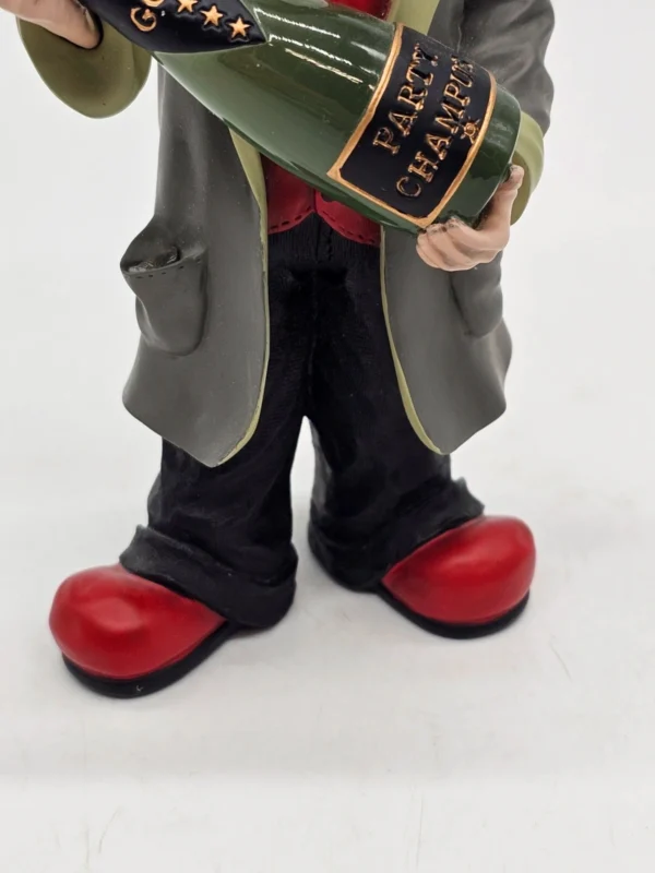 Gilde Clowns “Magnus” z butelką szampana – 17 cm (1. Ausgabe 2002)