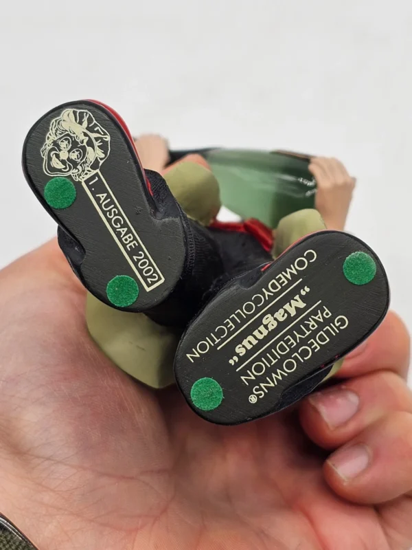 Gilde Clowns “Magnus” z butelką szampana – 17 cm (1. Ausgabe 2002)