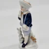 Porcelanowa figurka – chłopiec z królikiem