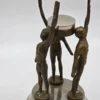 Mosiężna figurka świecznik z trzema postaciami vintage 24 cm