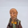 Figurka ceramiczna starszy pan siedzący na beczce wysokość 22 cm